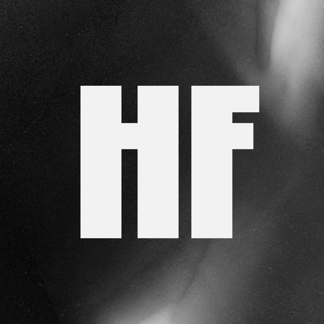 white hf logo on textured background